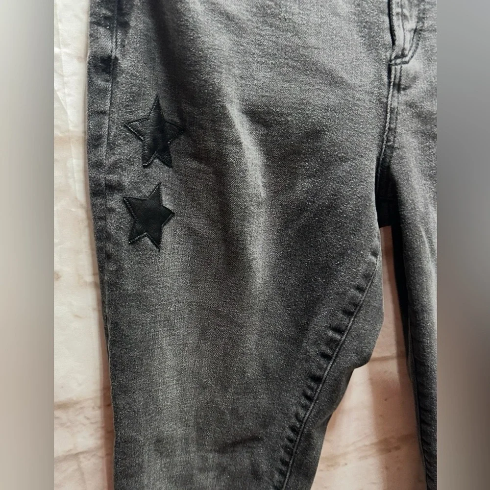 Juicy Couture women’s black‎ jeans with leathers stars size 28